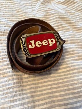 Vintage 1983 Solid Brass Jeep 4x4 belt buckle-Red/White logo on a Peterbilt belt